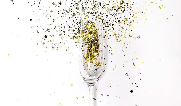 champagne glass with gold glitter